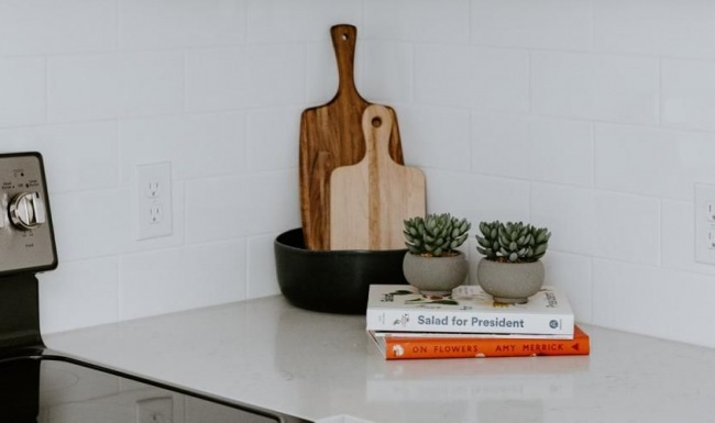 a kitchen with white cabinets